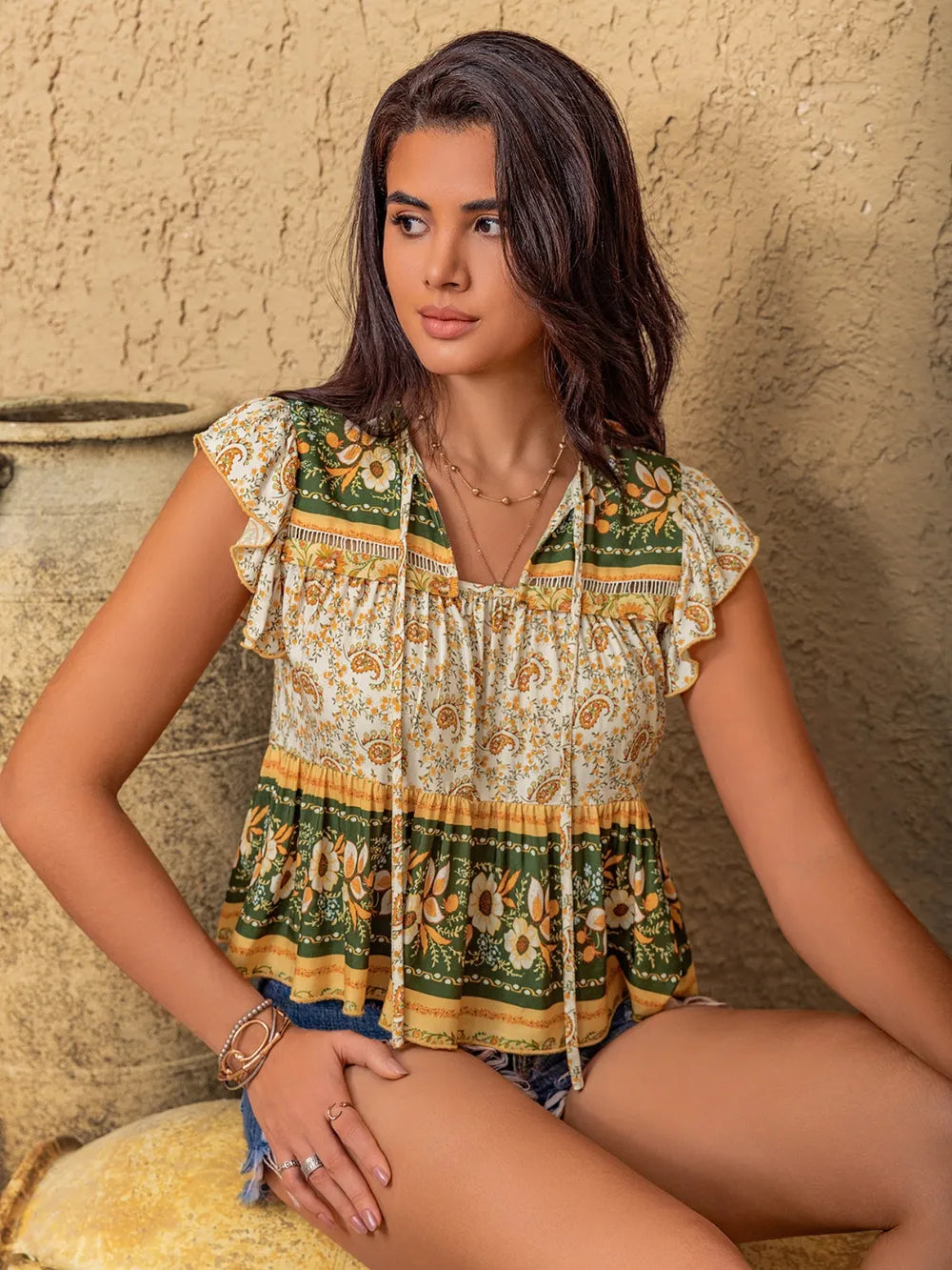 Ruffled Floral Tie Neck Cap Sleeve Blouse