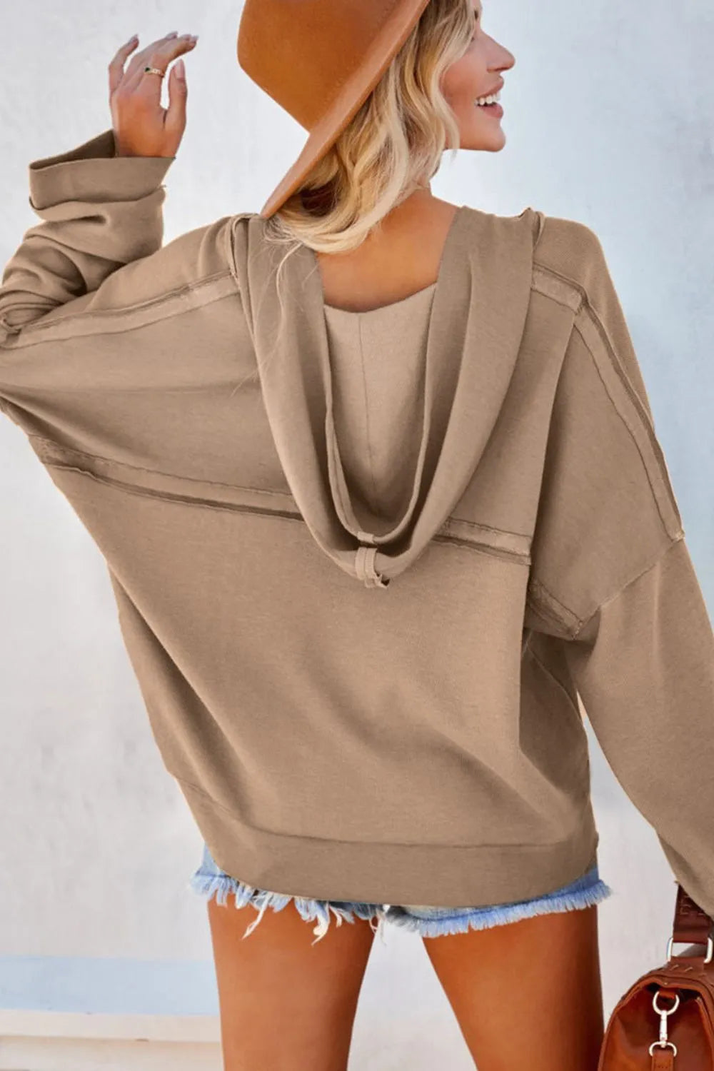 Trendy Exposed Seam Long Sleeve Hoodie with Button Detail - Cozy and Slightly Stretchy Fabric