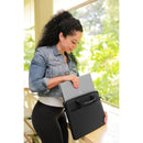 Woman lifting her laptop out of the Dell EcoLoop Black Sleeve Case for 11-14 Inch Notebooks, showcasing its organization and eco-friendly design.