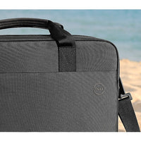 Stylish back view of the Dell EcoLoop Pro 16" Notebook Carrying Case on a sandy beach, emphasizing its professional look and versatility.