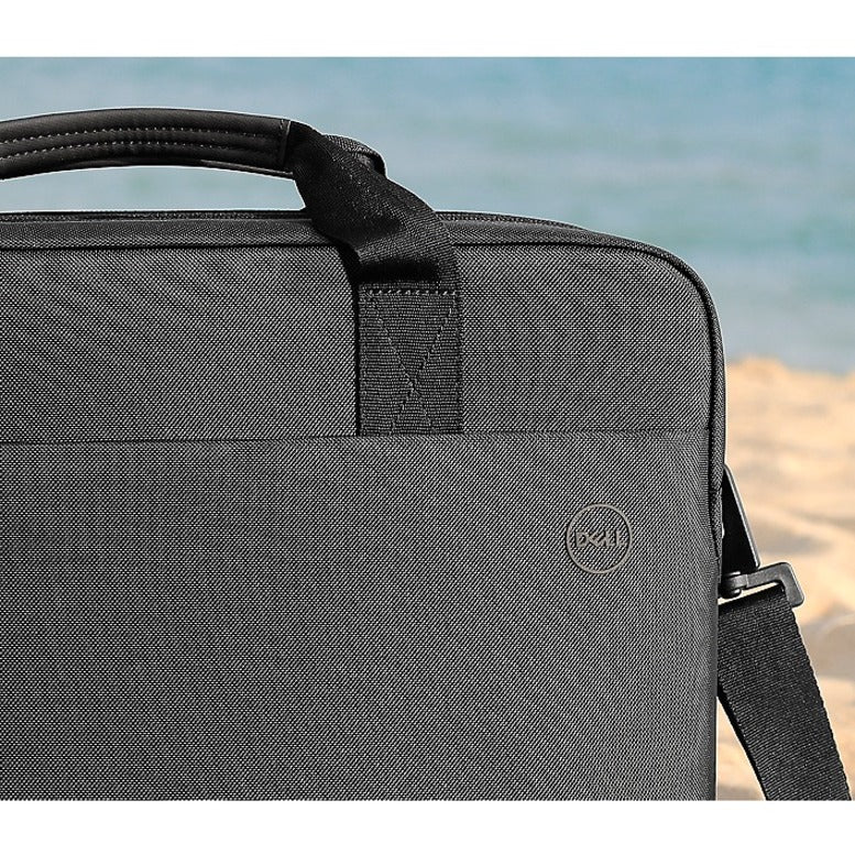 Stylish back view of the Dell EcoLoop Pro 16" Notebook Carrying Case on a sandy beach, emphasizing its professional look and versatility.