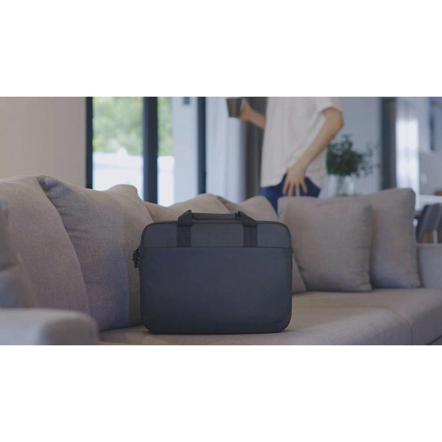 Dell EcoLoop Pro 16" Notebook Carrying Case elegantly placed on a chic sofa, showcasing its stylish black design and ideal for modern professionals.