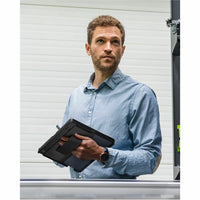 Professional individual holding Dell EcoLoop Rugged Case for 13.3" Latitude 7350, highlighting its sturdy design and practicality.