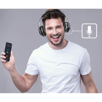 A cheerful man using the Adesso Xtream P500 Bluetooth Headset with Noise-Cancelling Microphone while holding a smartphone, showcasing wireless audio convenience.