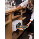 A user interacting with the Epson WorkForce ST-C2100 WiFi Supertank Color Printer, demonstrating its practicality in a workspace setting while taking advantage of its features.