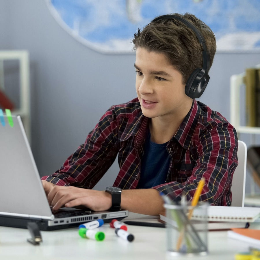 A young boy engaged in online learning with Morpheus 360 Serenity Wireless Over-Ear Headphones, emphasizing the product's suitability for education and entertainment.