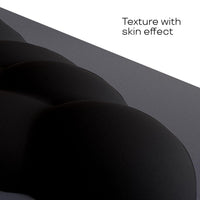 Close-up view of the CloudWrist Black Memory Foam Wrist Rest by Kokovolta, showcasing its unique texture with a skin effect that provides a luxurious feel.