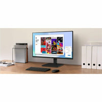 LG 27BA550B 27" FHD IPS Monitor positioned on a contemporary desk setup, illustrating its vibrant screen displaying creative content.