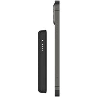 Profile view of the Belkin BoostCharge MagSafe Wireless Power Bank 2500 mAh, showcasing its slim design aligned with an iPhone, highlighting its portability and ideal for convenient charging.