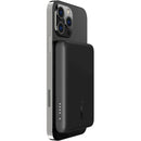 Belkin BoostCharge MagSafe Wireless Power Bank 2500 mAh securely attached to an iPhone, demonstrating its effective charging capabilities while maintaining style and functionality.