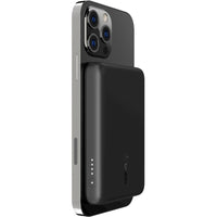 Belkin BoostCharge MagSafe Wireless Power Bank 2500 mAh securely attached to an iPhone, demonstrating its effective charging capabilities while maintaining style and functionality.