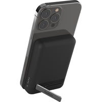Belkin MagSafe Power Bank 5K connected to an iPhone with a convenient kickstand for hands-free use.