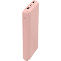 Stylish Belkin BoostCharge 20K Power Bank in soft pink, showcasing two USB-A ports and one USB-C port for versatile charging.