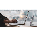 The Belkin BoostCharge Magnetic Power Bank 5000mAh with Stand for iPhone is featured beside a laptop in a stylish workspace, demonstrating the convenience of hands-free viewing and charging during your productive moments.