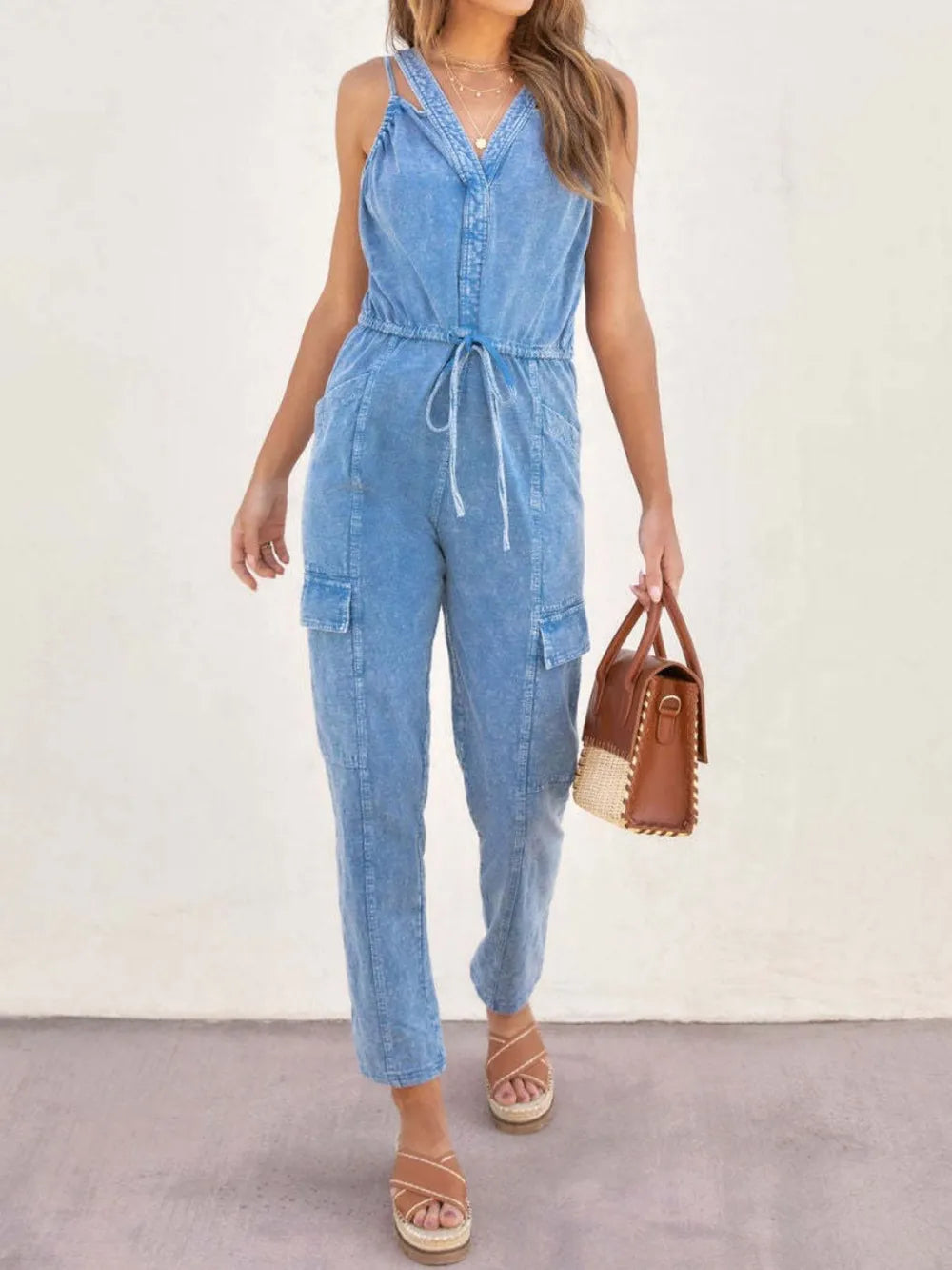 Women’s V-Neck Sleeveless Denim Jumpsuit with Pockets and Adjustable Drawstring