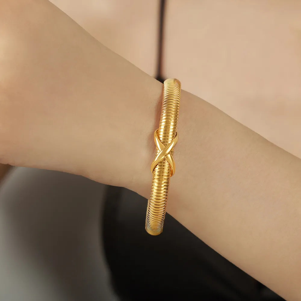 Elegant 18K Gold-Plated Titanium Steel Spring Shape Bracelet - Lightweight & Durable Design