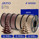 JAYO Wood PLA 3D Filament 1.75mm 1.1kg - 6 Roll Set featuring a beautiful assortment of earthy tones alongside a decorative 3D printed tree, ideal for artistic creations.