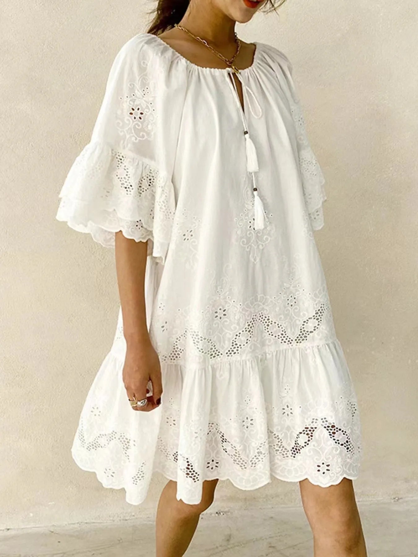 100% Cotton Eyelet Embroidered Dress with Tassel Tie Neck and Ruffled Detail